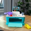 BABY EINSTEIN Hračka hudobná Kuchynka Magic Touch Kitchen™ Pretend to Cook HAPE 9m+